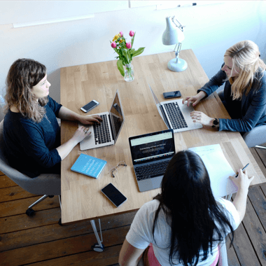 business finance being conducted around a table